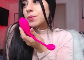 Busty clothed camgirl sucks vibrator